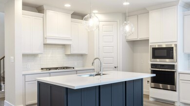 Kitchen featuring appliances with stainless steel