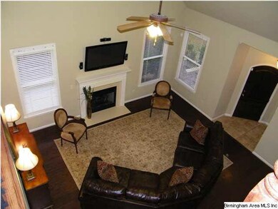 Hardwood floors and lots of natural daylight throu
