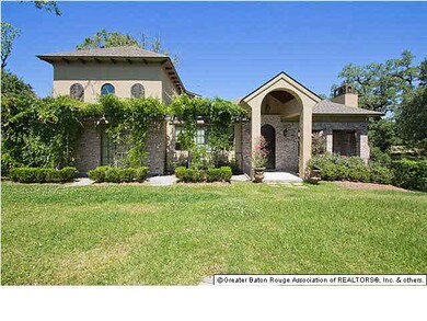 This home features a variety of landscaping and ar