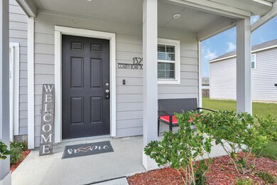 This welcoming front porch features a cozy seating