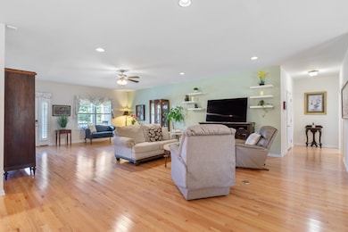 The Living Room has gorgeous hardwoods and 2 Floor electrical outlets and recessed lighting were installed.