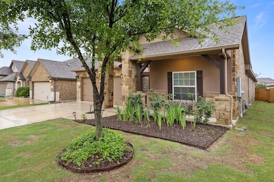View of front facade with concrete driveway, a sh