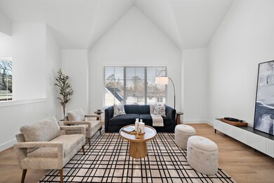 Second floor living room has soaring 16 foot ceili