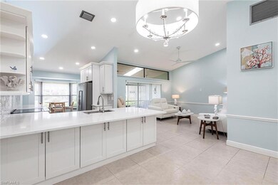 Kitchen featuring high quality fridge, a sink, a ceiling fan, white cabinetry, and light countertops