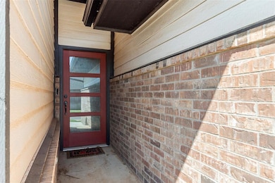 Property entrance with brick siding
