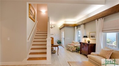 Note the tall ceiling with cove lighting above the