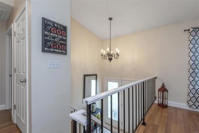 View from upper level. Ceiling Chandelier.
