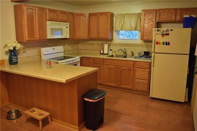 Lovely neutral ceramic back splash. Appliances inc