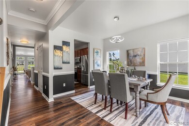 Dining area with dark hardwood / wood-style floors