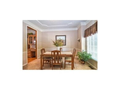 Formal dining room with chair rail, crown molding 