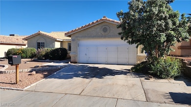 Mediterranean / spanish house featuring driveway,