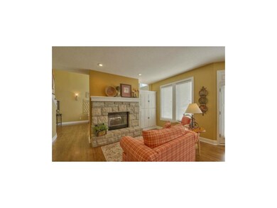 Hearth room with stone fireplace