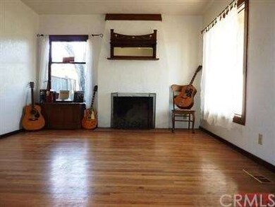Beautiful vintage living room with large woodburni
