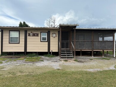 Front porch facing rolling pasture land and trees