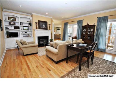 Formal living room with fire place and side built ins