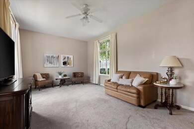 Extra tall windows on both side of living room let