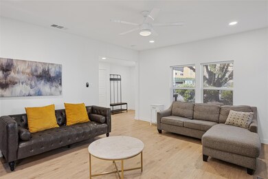 Living area featuring recessed lighting, wood finished floors, and ceiling fan
