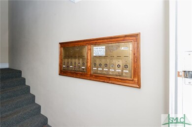 A view of the brass mail boxes and stairs leading 