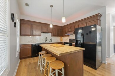 Kitchen with butcher block counters, under cabinet