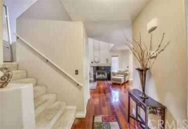 Cherry hardwood floors and neutral paint throughou