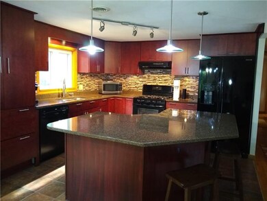 The cherry colored wood and black appliances is the perfect blend, don't you think?