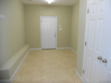 MASSIVE laundry room with double door coat closet.