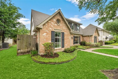 Alternate view of exterior shows beautiful lush professional landscaping and pride of ownership! High end upgrades galore!  Irrigation (Rainbird 10 zone with 22 zone capacity), drainage (14 French drains) and 6