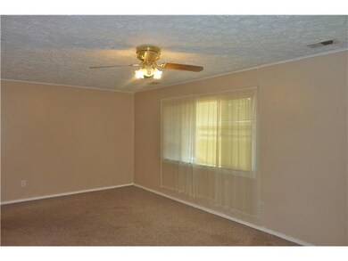 Living Room Living room with tile entryway, carpet