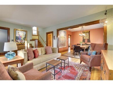The Living Room features gleaming Hardwood Floors.