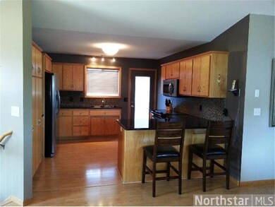 Nice sized kitchen with door leading to the mainte