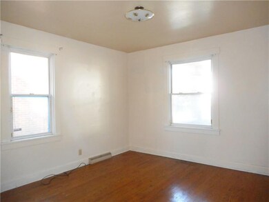 Main floor master bedroom with hardwood flooring