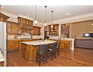 Kitchen. Kitchen has granite counters, custom wood cabinets w/built-in organizers!