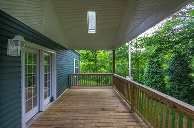 Side porch with cathedral ceilings and sky lights.