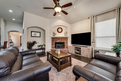 Cozy family room with brick fireplace.