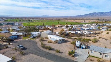 FULLY FENCED .60 ACRE LOT WITH RV GARAGE & PLENTY