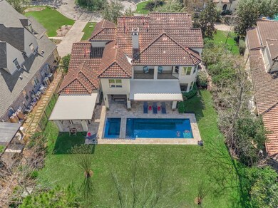 An aerial view shows the the home perimeter and ba