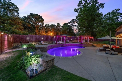 View of pool featuring a fenced backyard, a patio area, a gazebo, and a pergola
