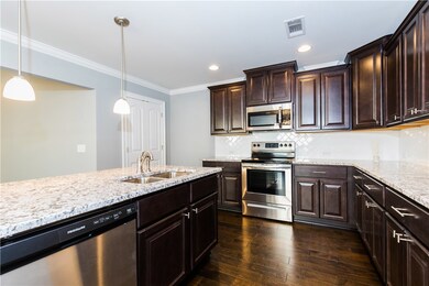 Kitchen with granite counters and stainless steel