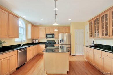 Tons of cabinets and counter space in the kitchen!!  Hardwood floors, granite counters, recessed lights, Stainless refrigerator and Dishwasher.  New gas range and microwave to be installed soon (will be stainless)