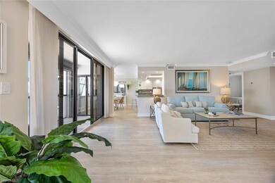 Living room featuring ornamental molding and light