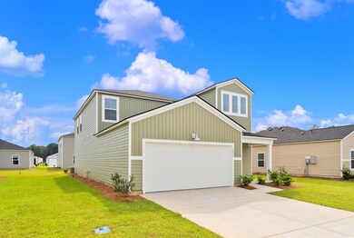 View of front of home featuring a garage and a fro