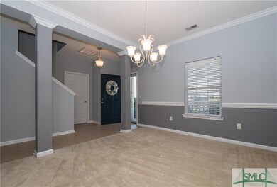 Formal dining room with chair rail, complementary 