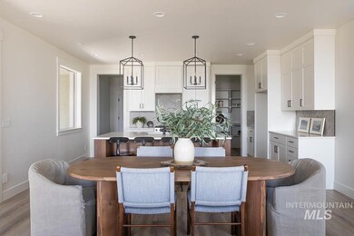 Dining room with wood finished floors and recessed lighting