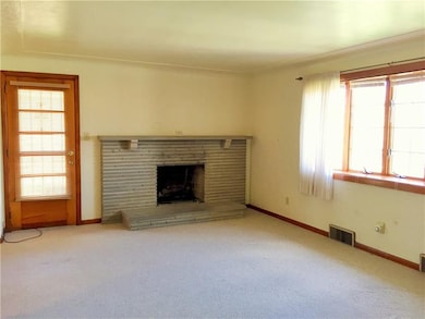 Enter into the Living Room from the large covered 
