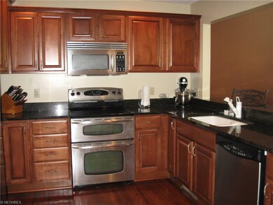 Beautiful maple/granite kitchen with stainless steel appliances.