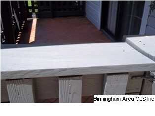 Covered front patio with gate.
