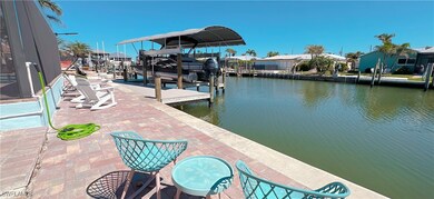 Dock area with boat lift and a water view