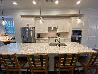 Kitchen with appliances with stainless steel finis