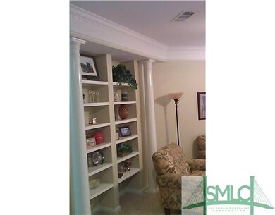 Living Room. Built-in bookcases and wide crown mol