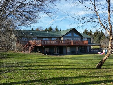 An expansive deck overlooks 2 acre fully fenced ba